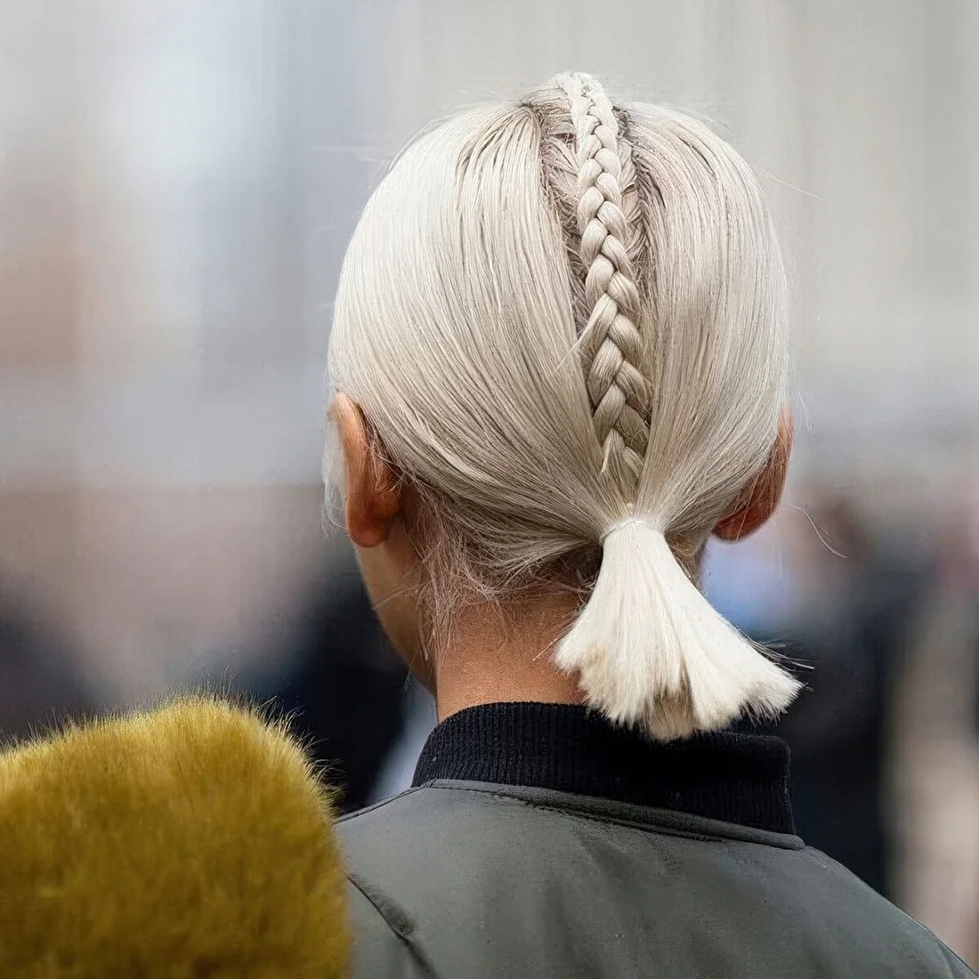 Photo showing low ponytail with a braid on top, with the hairstyle clearly visible.