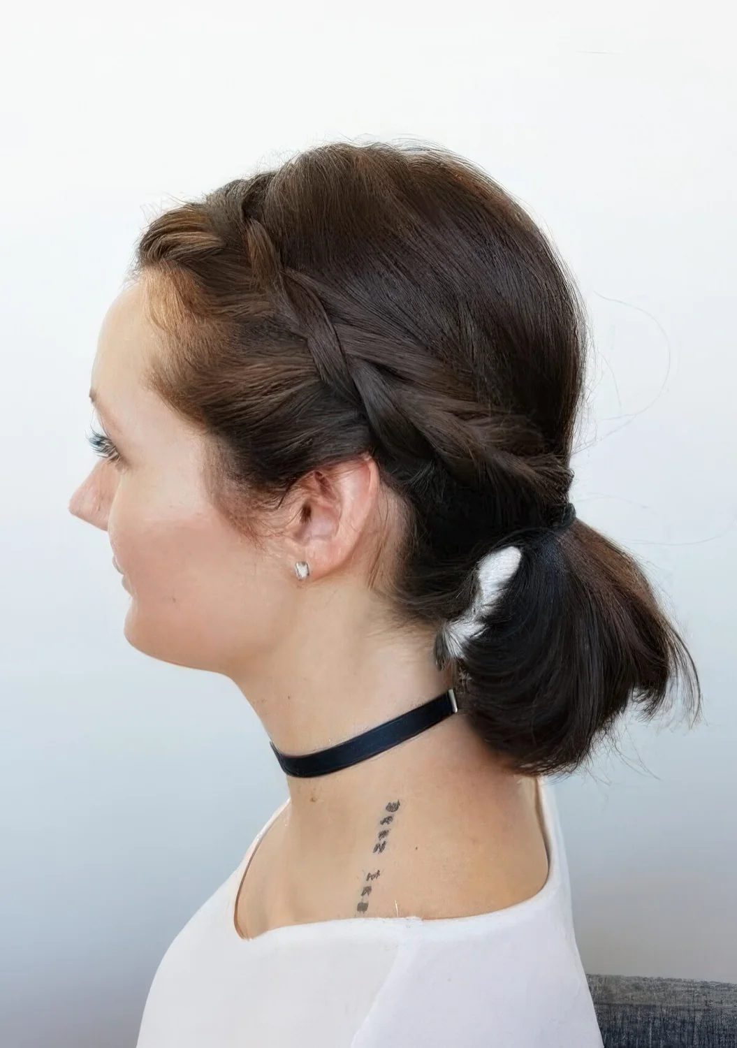 Photo showing low ponytail with a braided halo, with the hairstyle clearly visible.