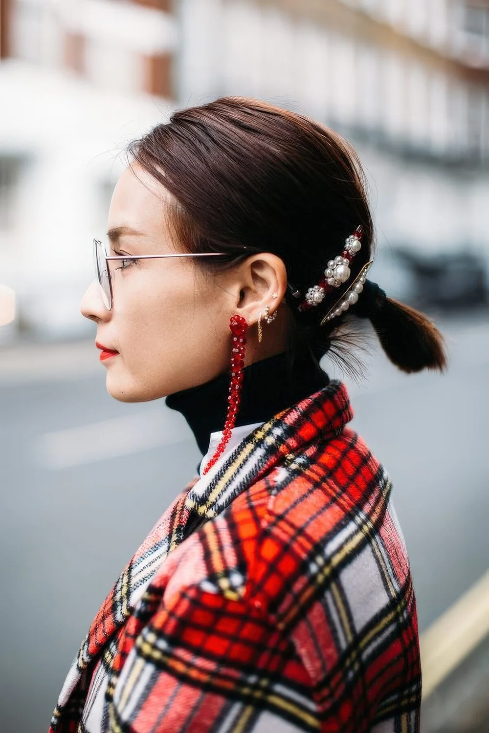 Small low ponytail with pearl barrettes.