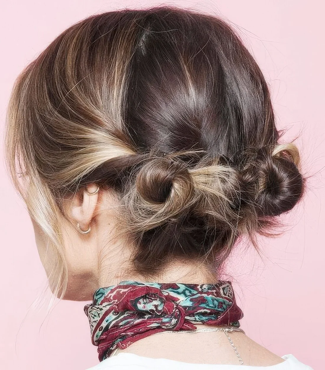 Easy and messy little low buns and some hair down are a great and catchy hairstyle.
