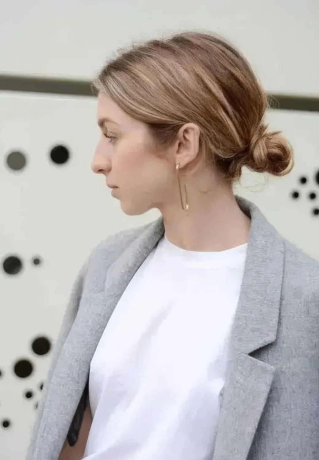 Messy low bun with a textured volume on top.