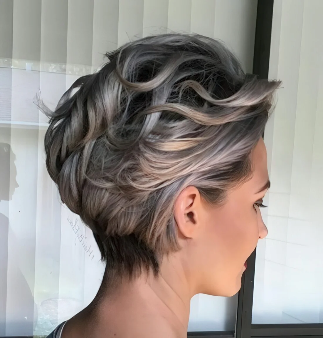 Women over 50's short hairstyle with waves.