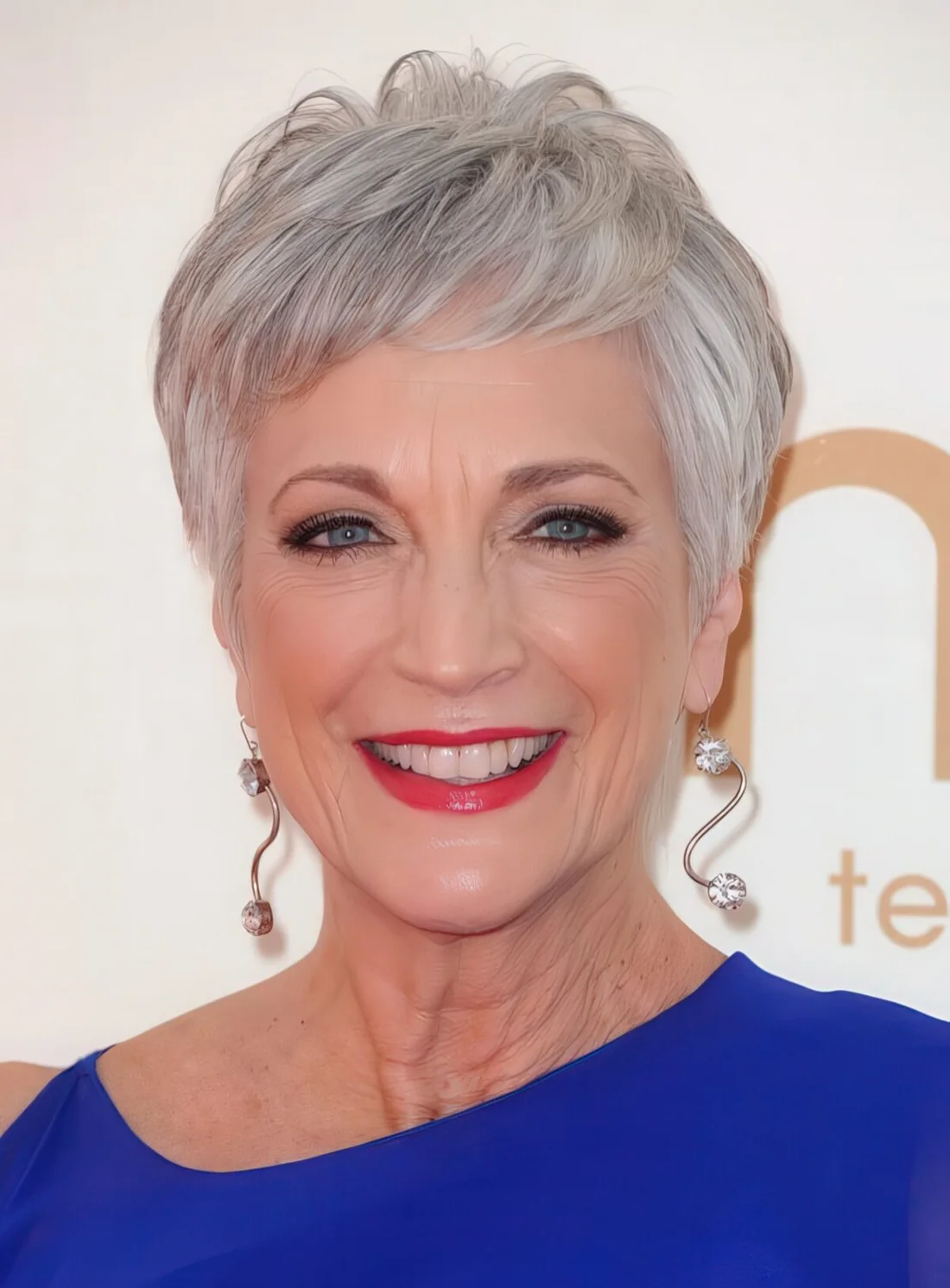Long grey hair pixie haircut with layers.