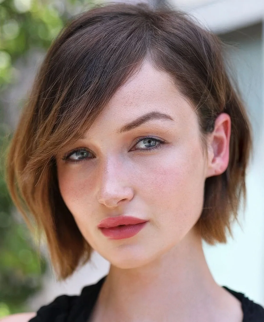 Chin-length brown bob with caramel ombre, side part and side bangs.