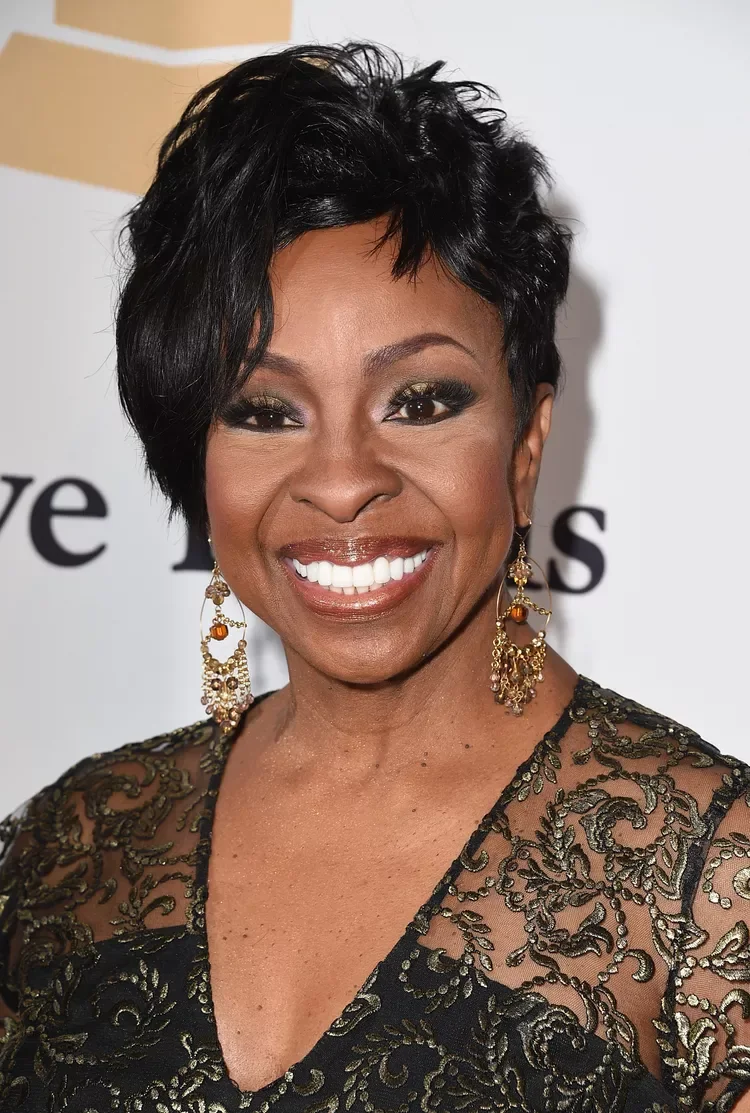 ear straight black pixie with side swept fringe shown as a short hairstyles for older black women idea
