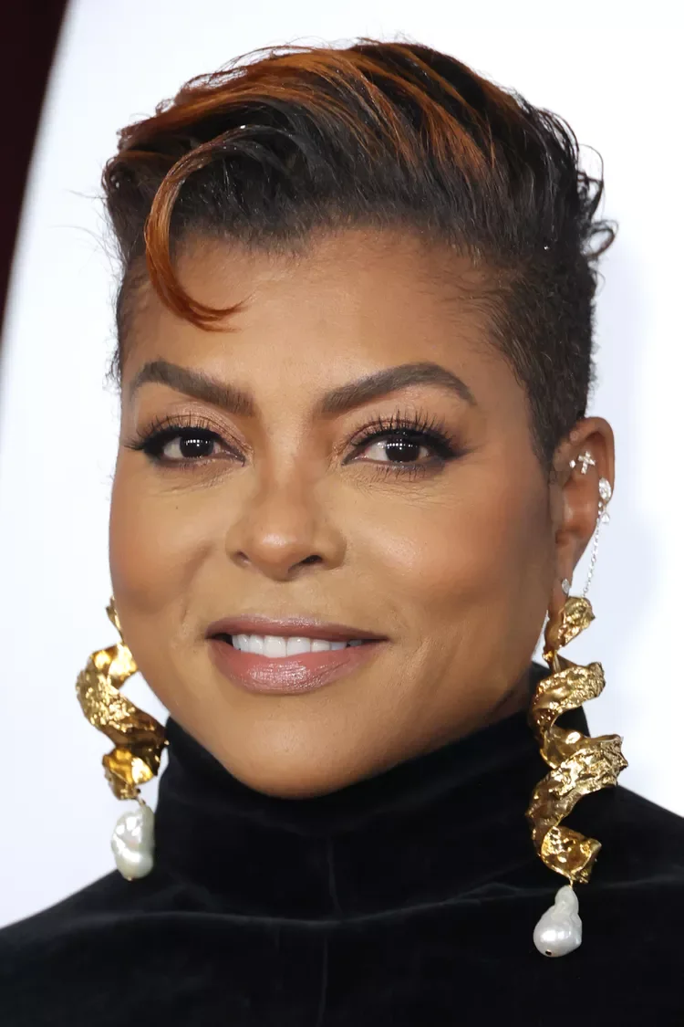 ear coily black pixie with side swept fringe shown as a short hairstyles for older black women idea
