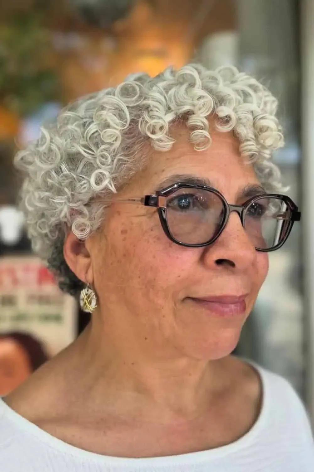 neck curly silver curly style shown as a short hairstyles for older black women idea, featuring curly texture