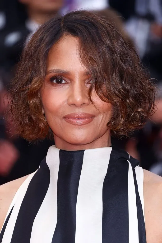 ear curly black curly bob with curly fringe fringe shown as a short hairstyles for older black women idea