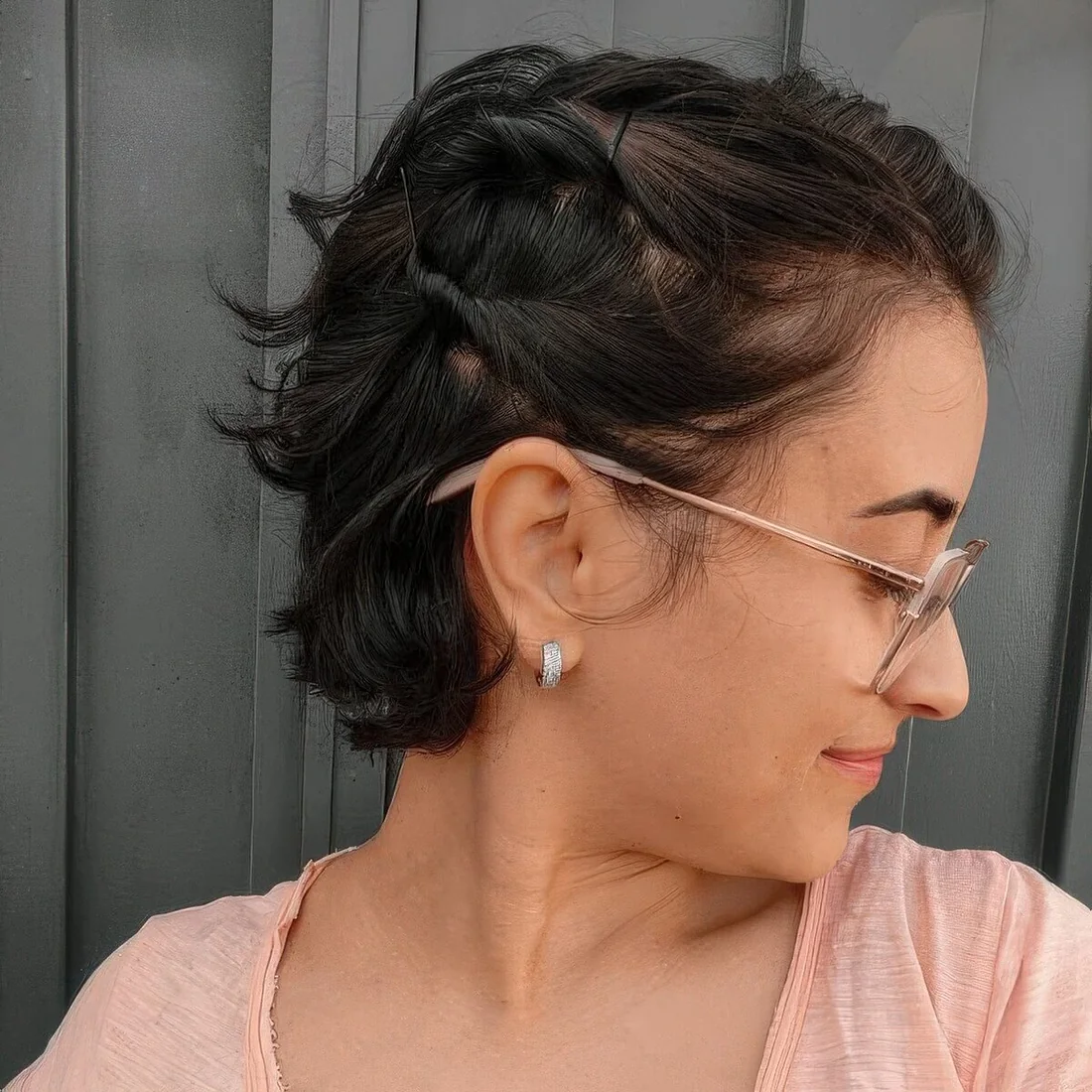 Photo showing short black bob hairstyle, with the hairstyle clearly visible.