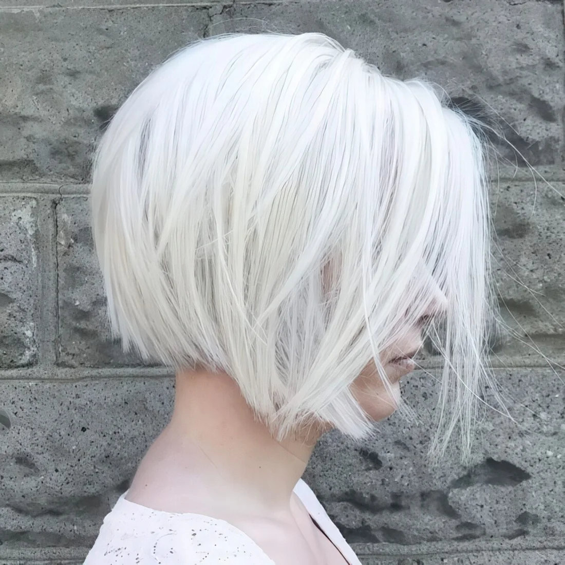 Photo showing such a layered silver white bob, with the hairstyle clearly visible.