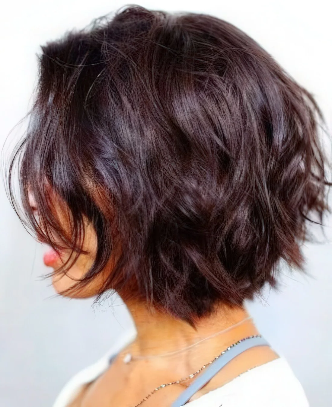 Photo showing layered black cherry bob haircut, with the hairstyle clearly visible.