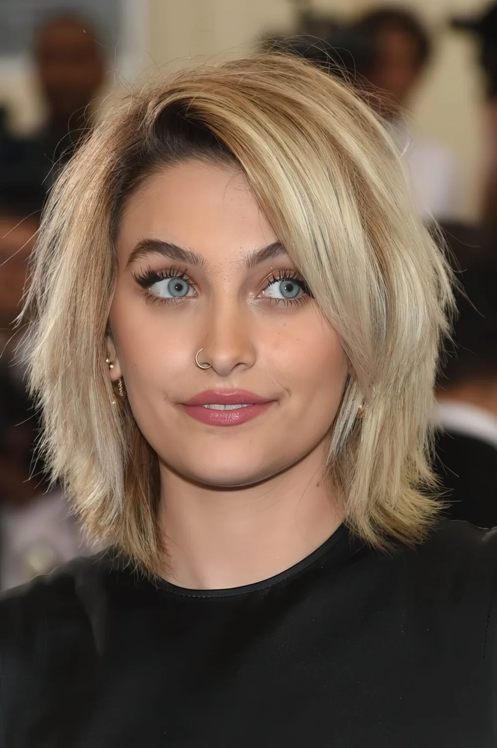 Short layered haircut with bangs and much texture for a trendy and modern feel.