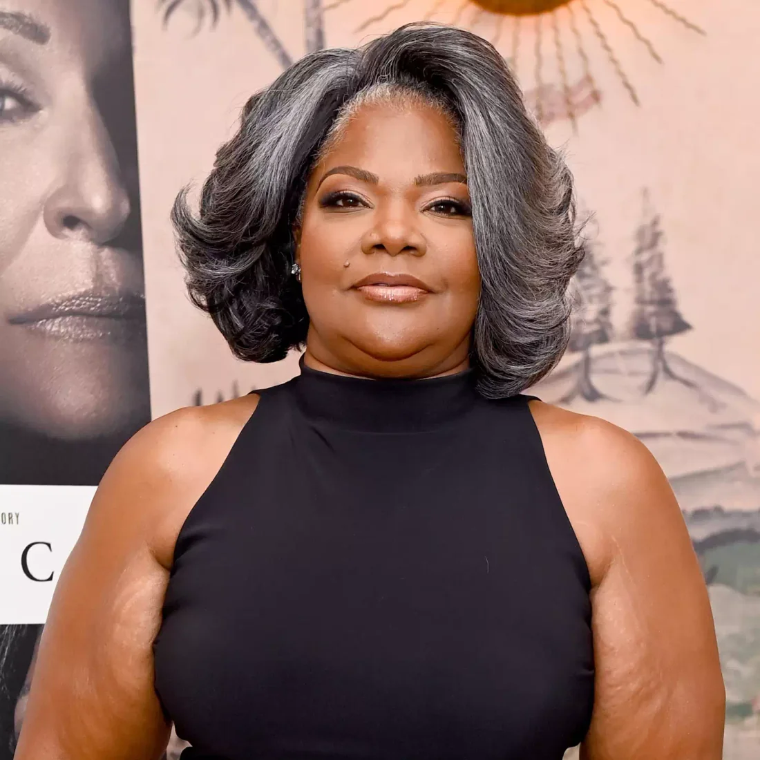 Grey blending layered bob with feathered volume and softly turned ends.