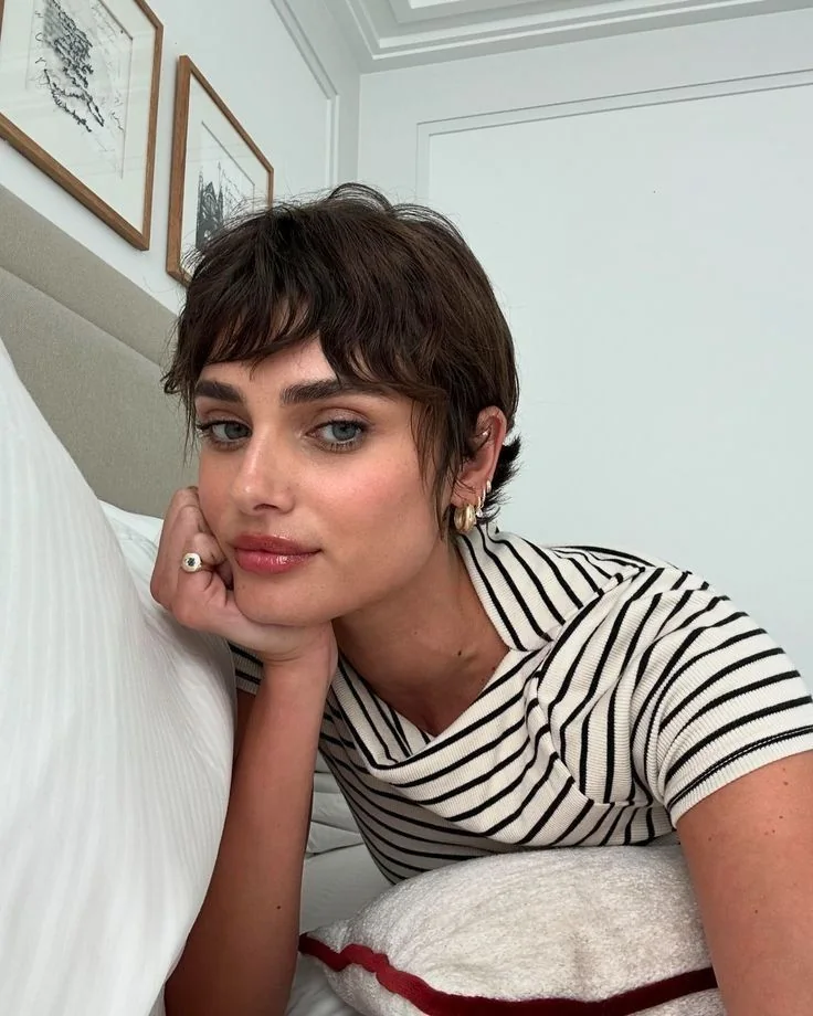 Photo showing wavy long pixie, with the hairstyle clearly visible.