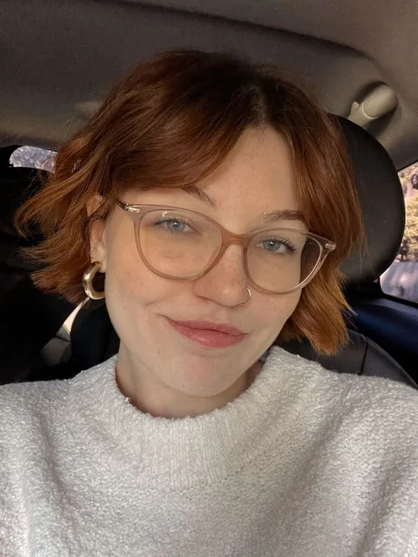 Photo showing ginger bob with bangs, with the hairstyle clearly visible.