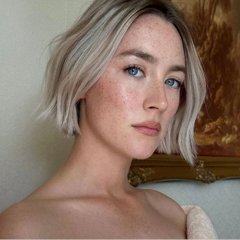 Photo showing blonde short bob, with the hairstyle clearly visible.