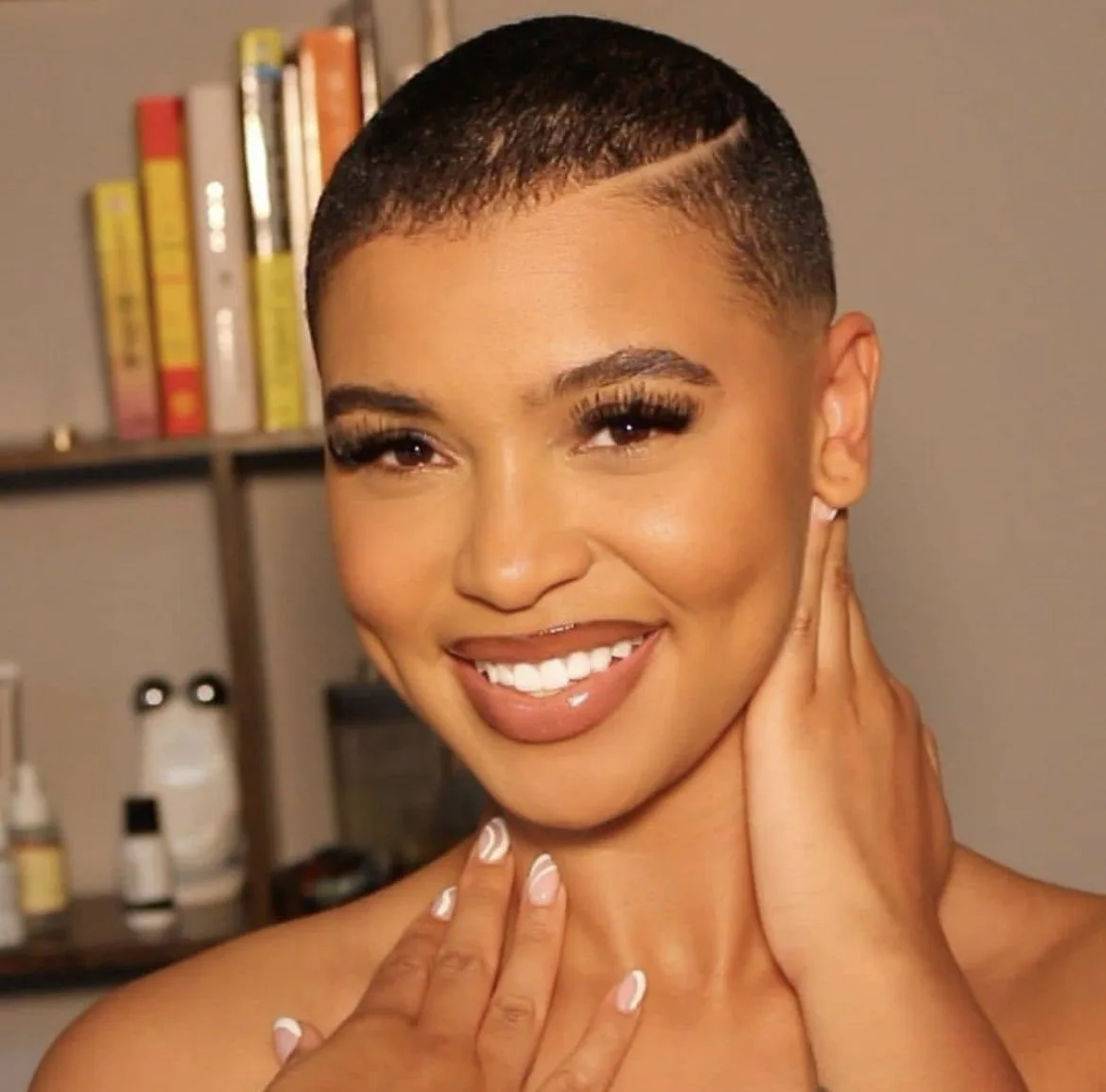 ear coily black curly style shown as a short natural hairstyles for black women over 50 idea, featuring coily texture