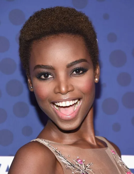 ear coily black curly style shown as a short natural hairstyles for black women over 50 idea, featuring ear outline