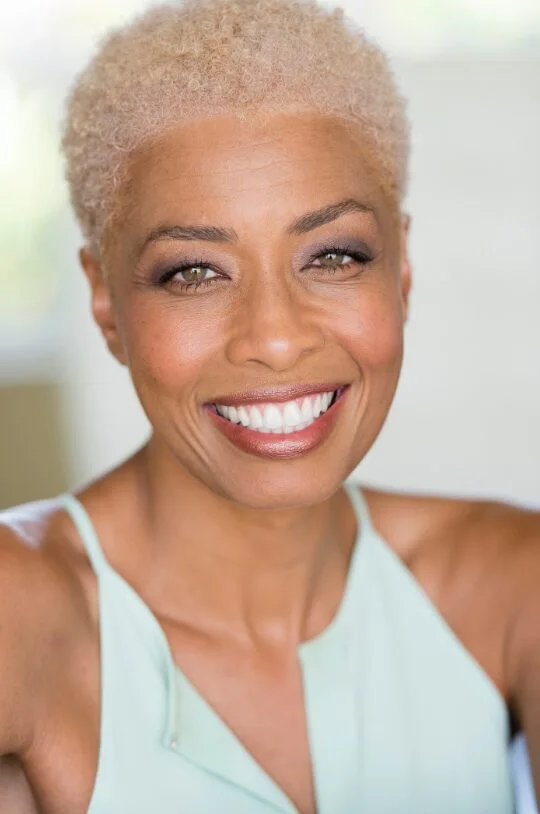 ear curly black curly style with curly fringe fringe shown as a short natural hairstyles for black women over 50 idea