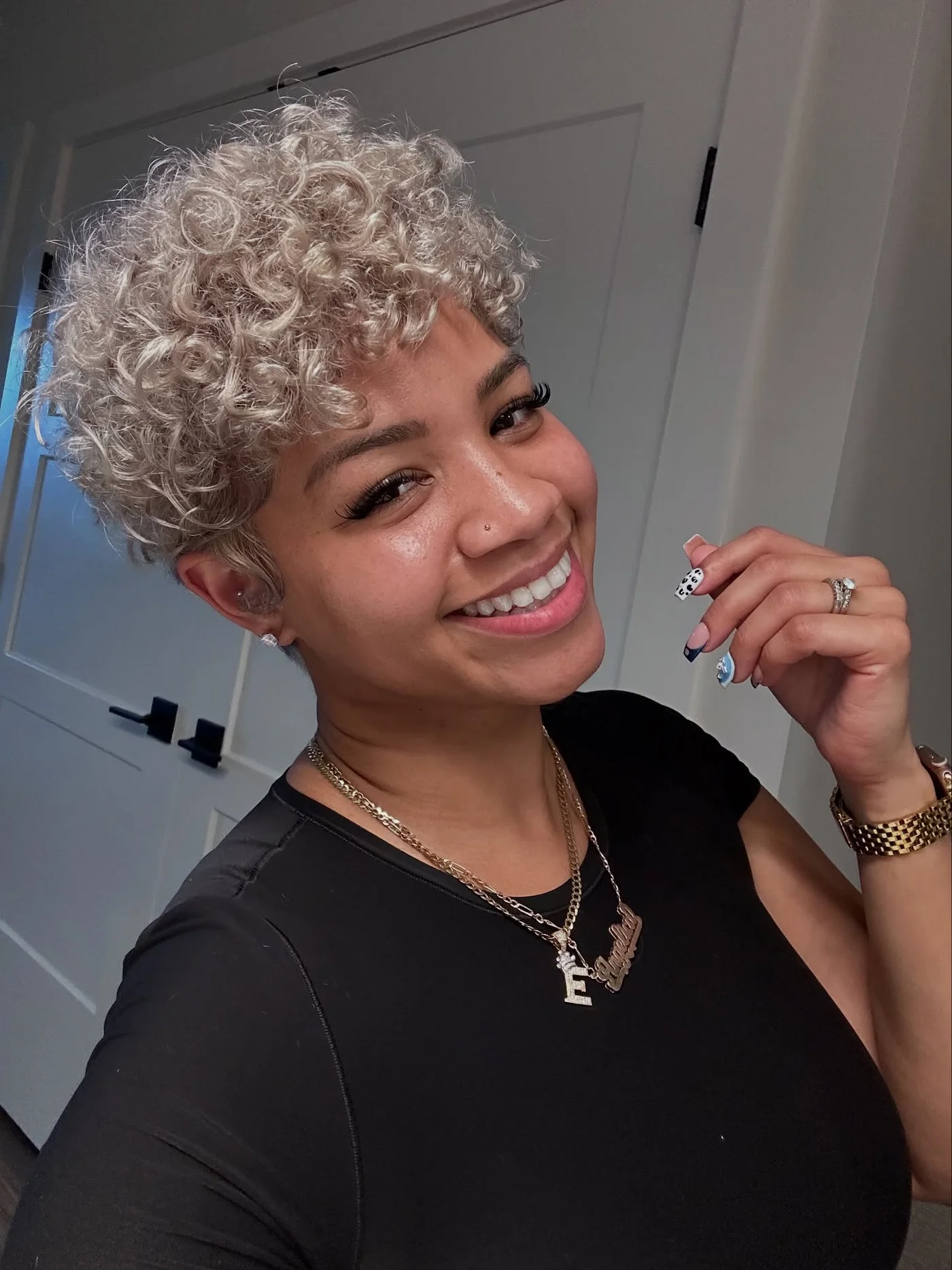 ear curly black curly style with curly fringe fringe shown as a short pixie cut ideas idea, featuring medium layering