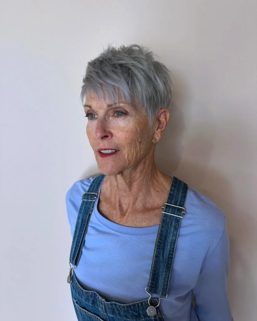 ear straight silver pixie with side swept fringe shown as a short pixie haircuts for older women idea, featuring ear outline