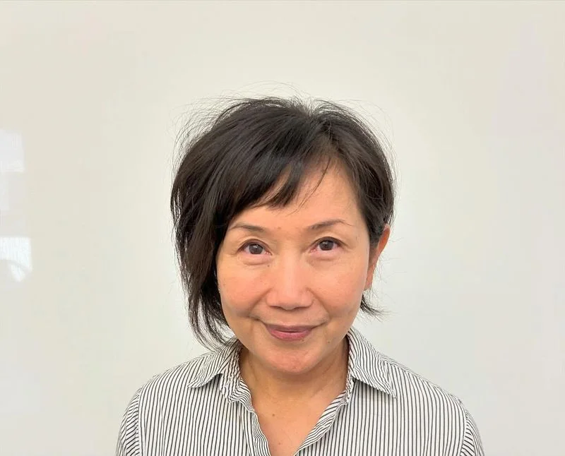 ear straight chestnut pixie with side swept fringe shown as a short pixie haircuts for older women idea