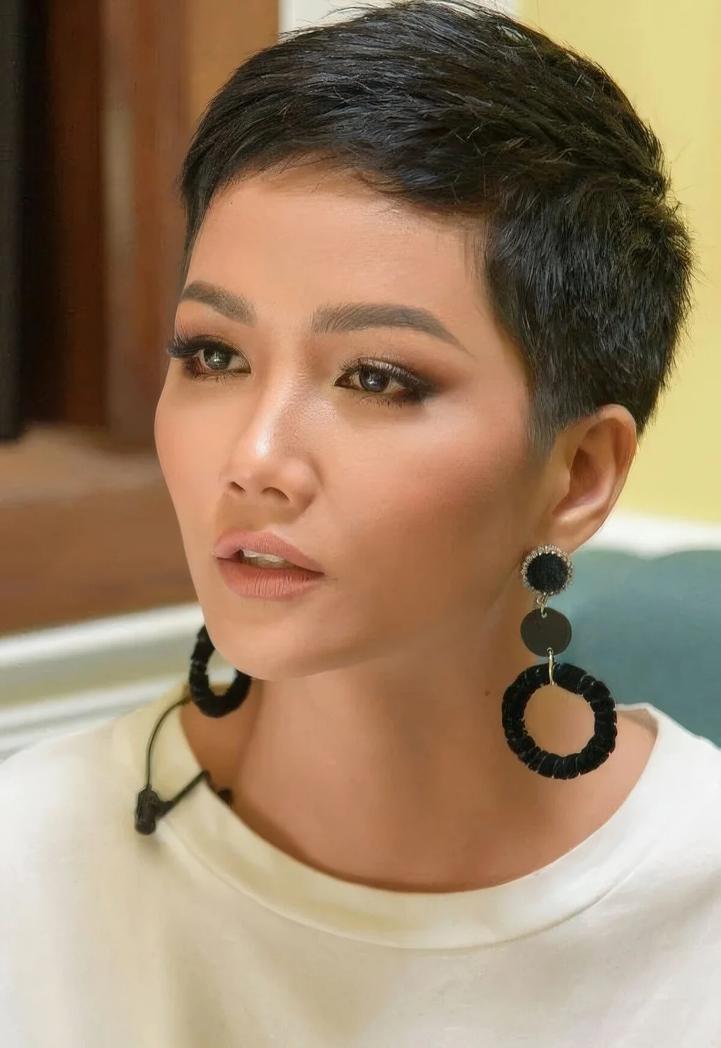 Photo showing black pixie haircut on thick hair, with the hairstyle clearly visible.