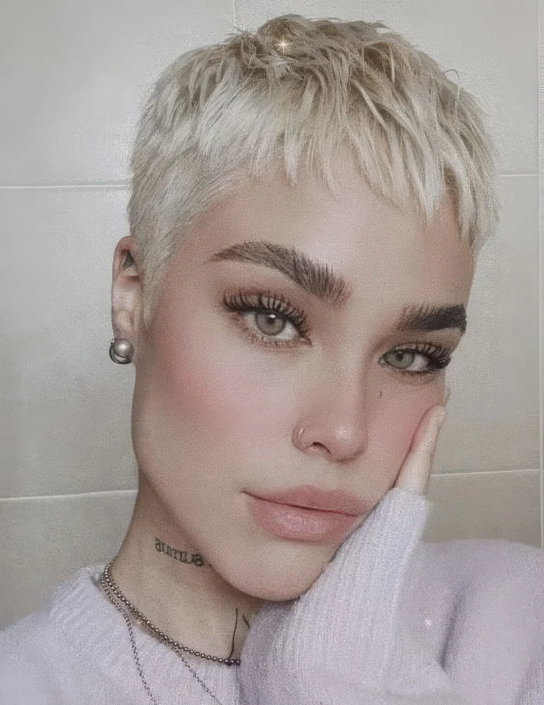 Short blonde pixie with layers and texture.