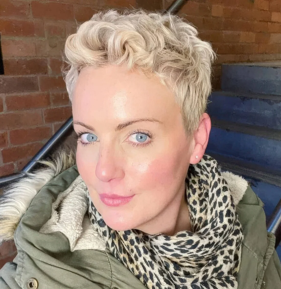 Photo showing wavy pixie haircut, with the hairstyle clearly visible.