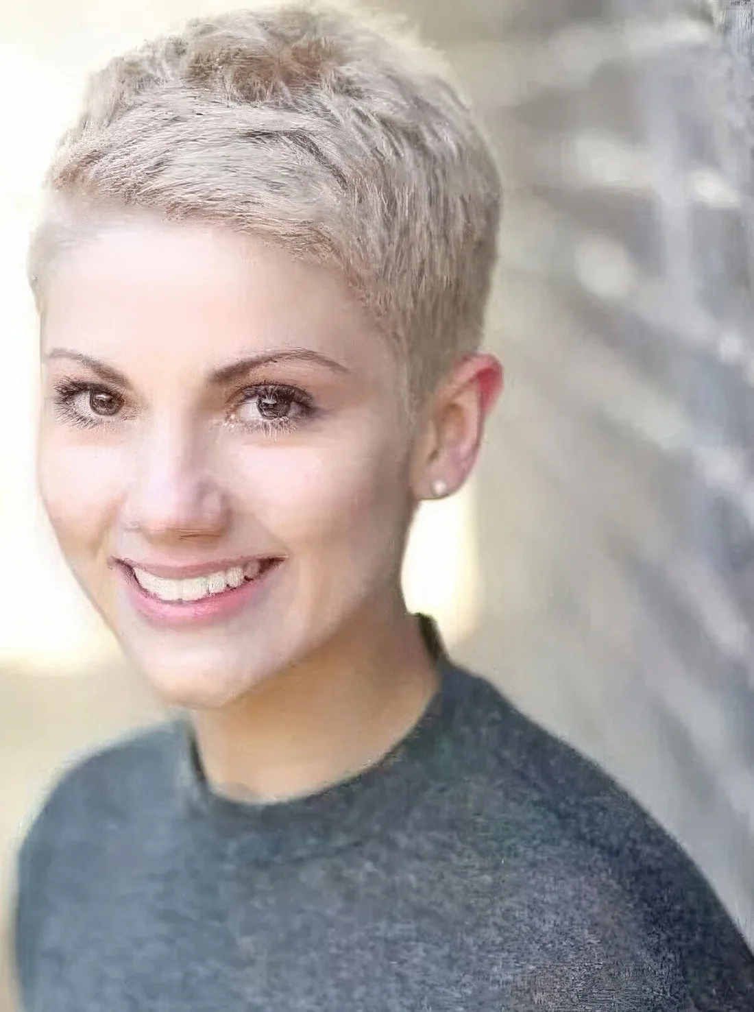 Very short pixie haircut on blonde.