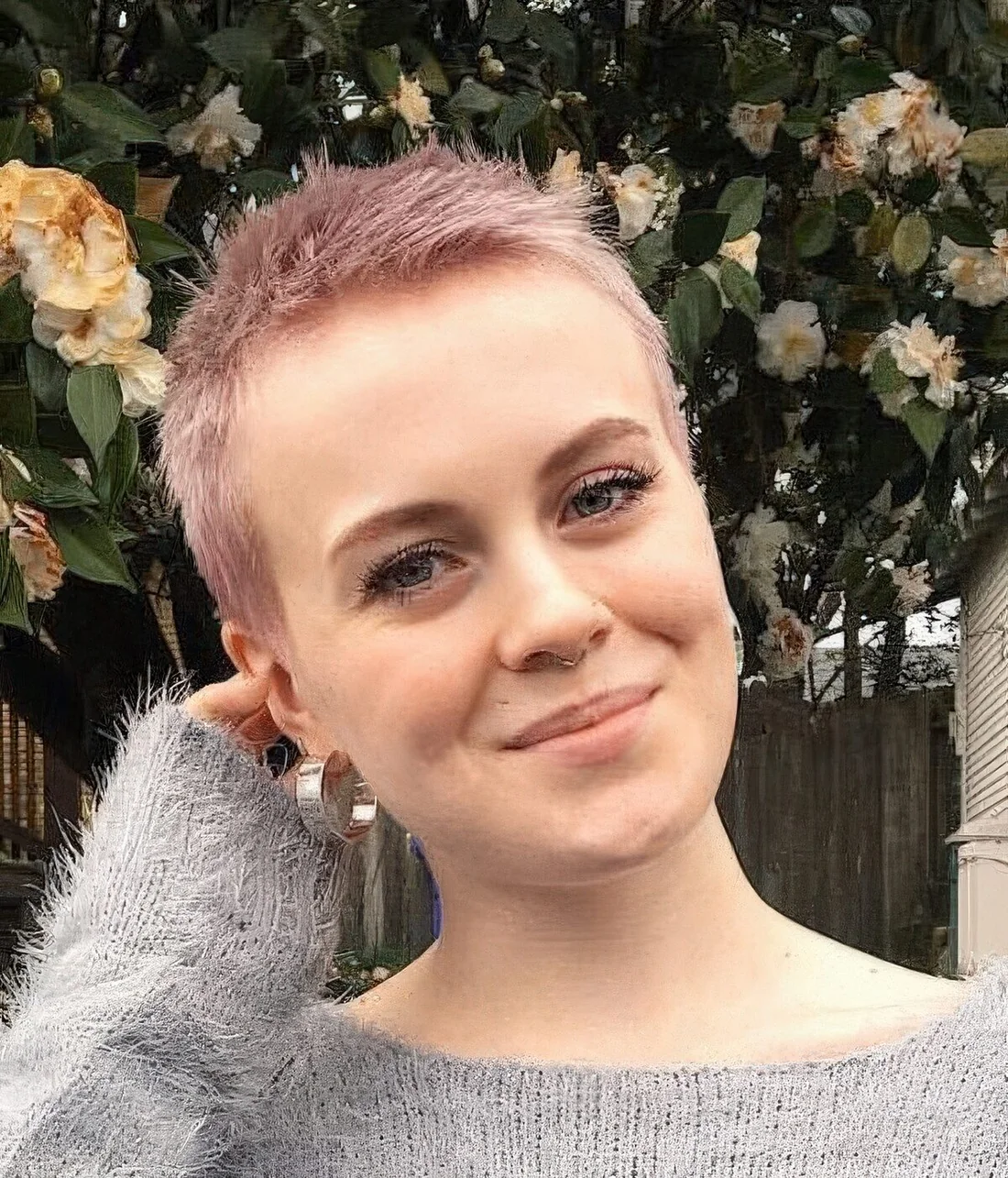 Photo showing pastel pink short hairstyle, with the hairstyle clearly visible.