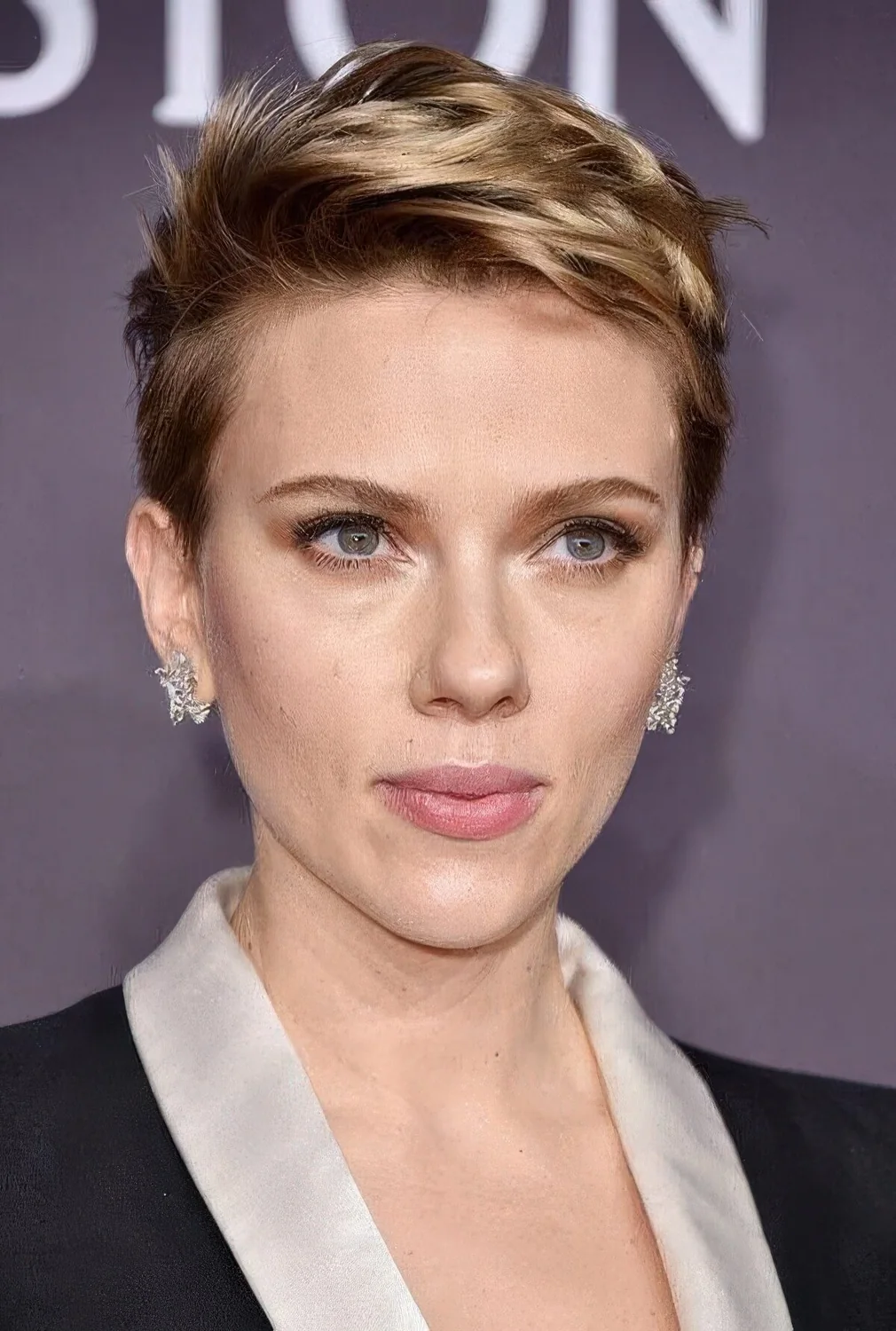 Scarlett Johansson wearing a textural short blonde pixie.