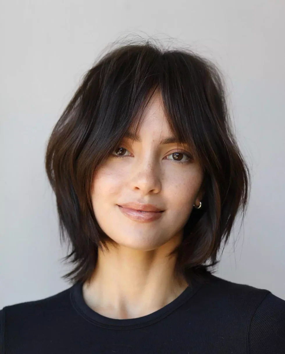 shoulder wavy blue color with curtain fringe shown as a short wolf curtain bangs idea