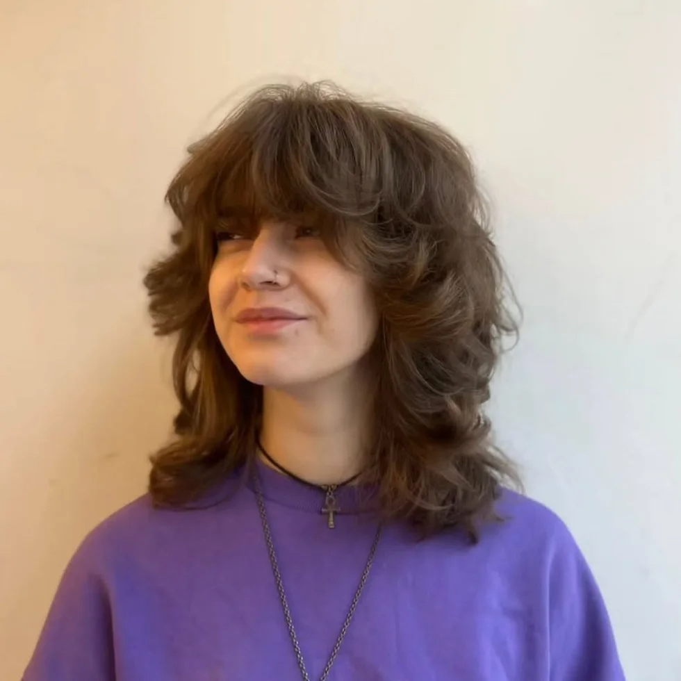 shoulder wavy honey shag with curtain fringe shown as a short wolf curtain bangs idea