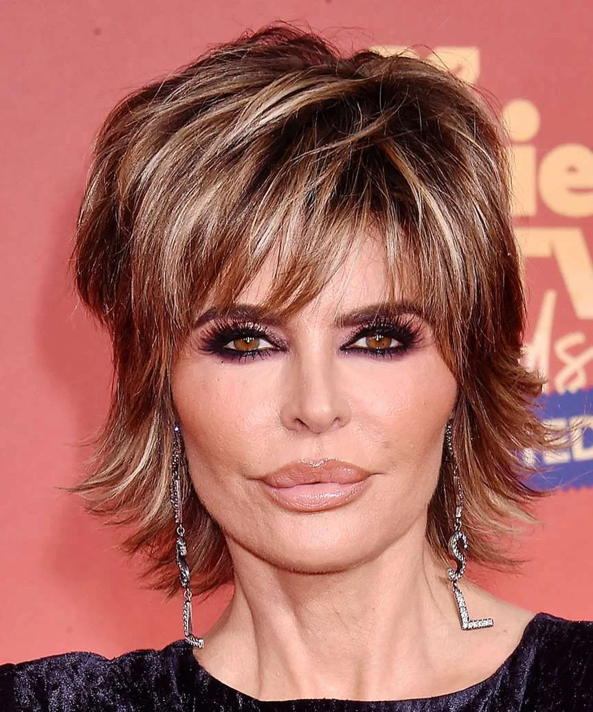 shoulder wavy chestnut shag with curtain fringe shown as a short wolf curtain bangs idea, featuring volume through the all over