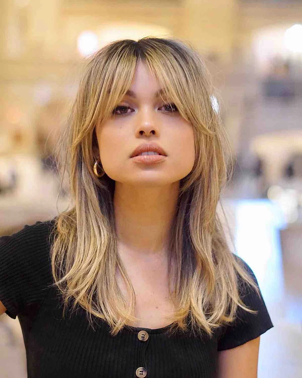 shoulder wavy honey shag with curtain fringe shown as a short wolf curtain bangs idea, featuring curtain fringe