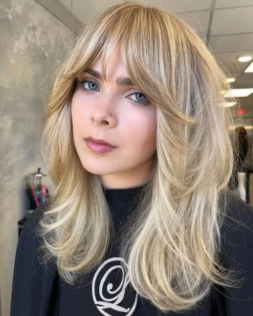 shoulder wavy chestnut lob shown as a shoulder length hairstyles for thin fine hair idea, featuring volume through the low volume, shown in feathered blonde lob with wispy bangs