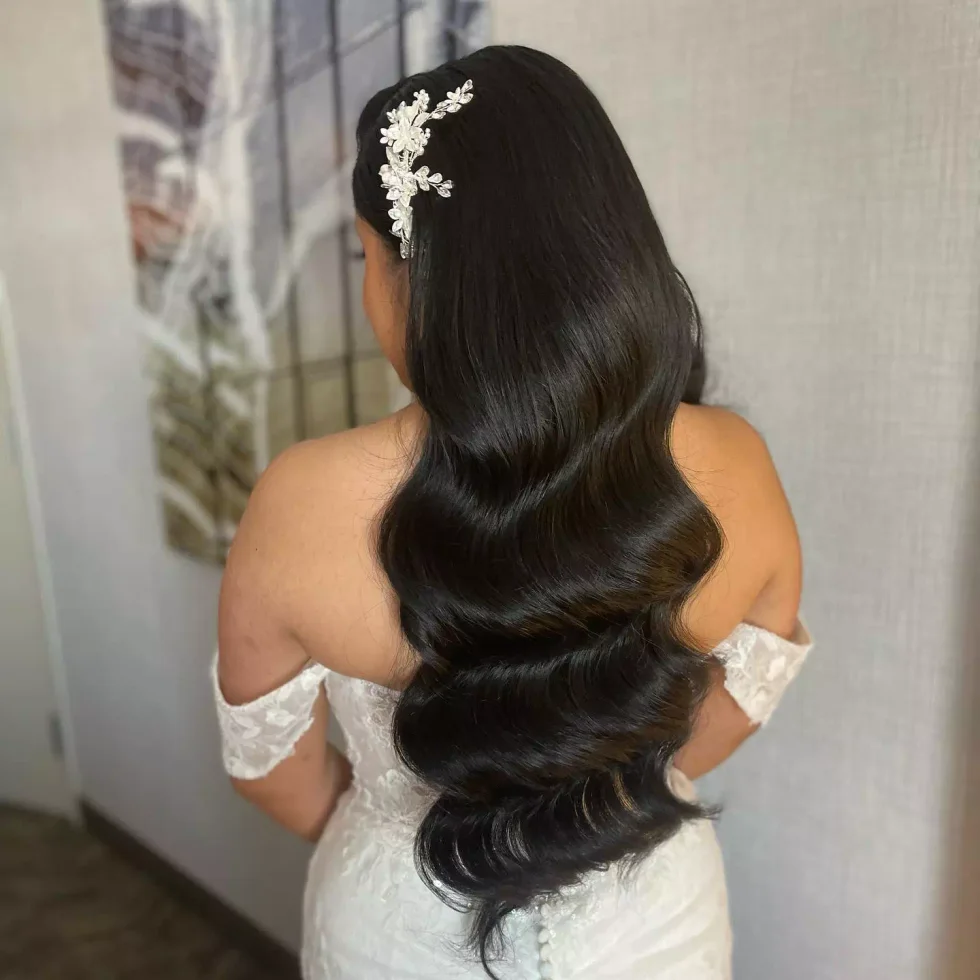 chin wavy chestnut bob shown as a simple wedding guest hair idea, featuring wavy texture