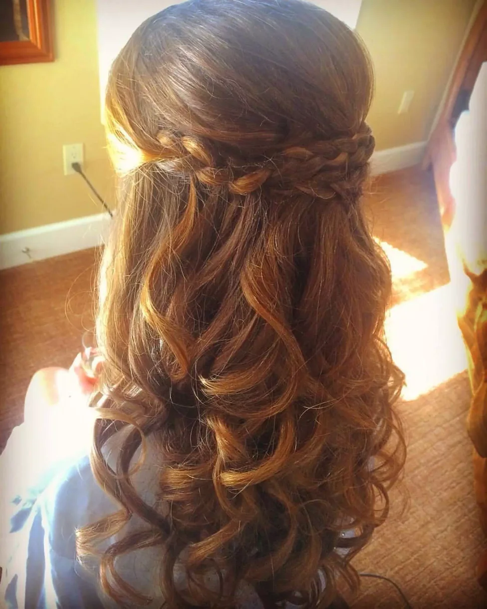 chest wavy black layers shown as a simple wedding guest hair idea