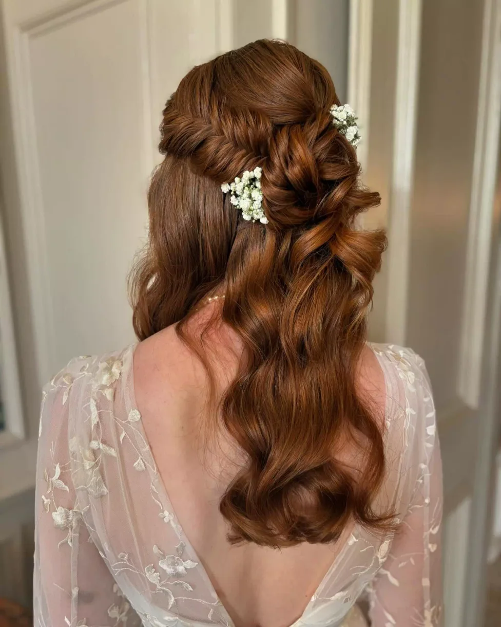 chest wavy brunette ponytail shown as a simple wedding guest hair idea, featuring chest outline