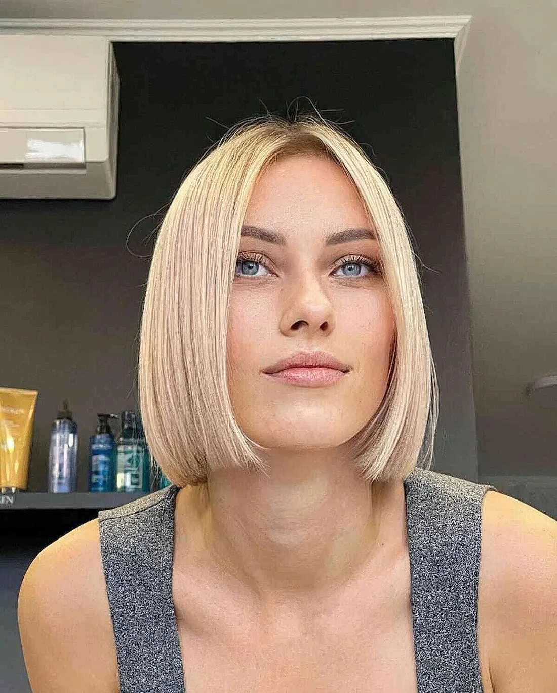 Photo showing chin-length vanilla blonde slob, with the hairstyle clearly visible.