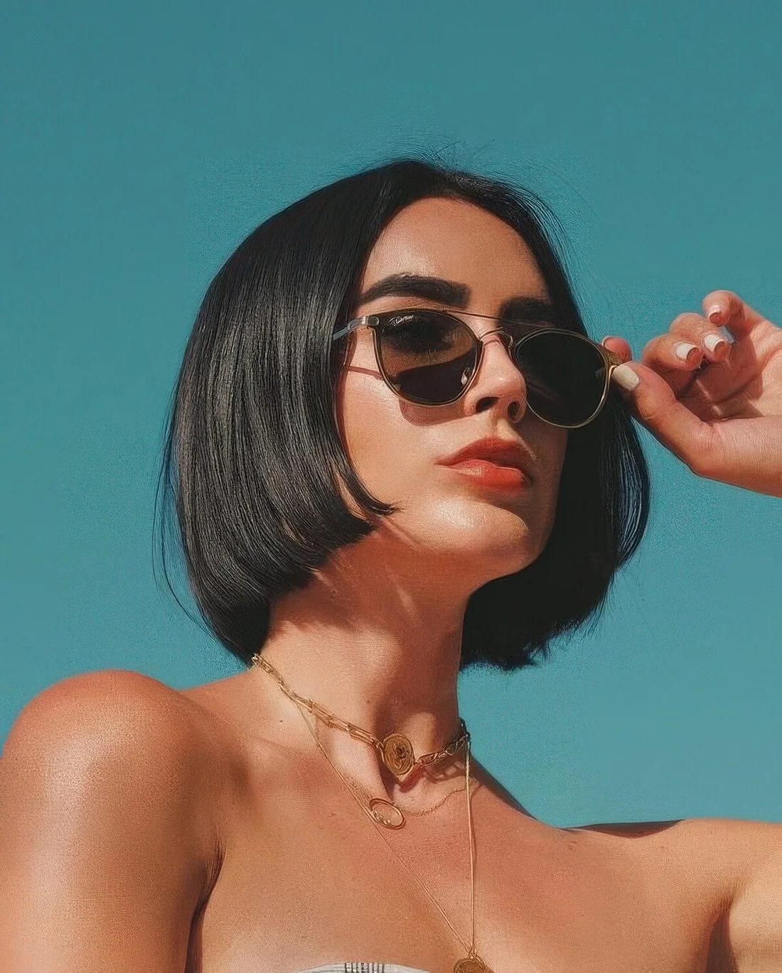 Classic black chin-length bob with center part.