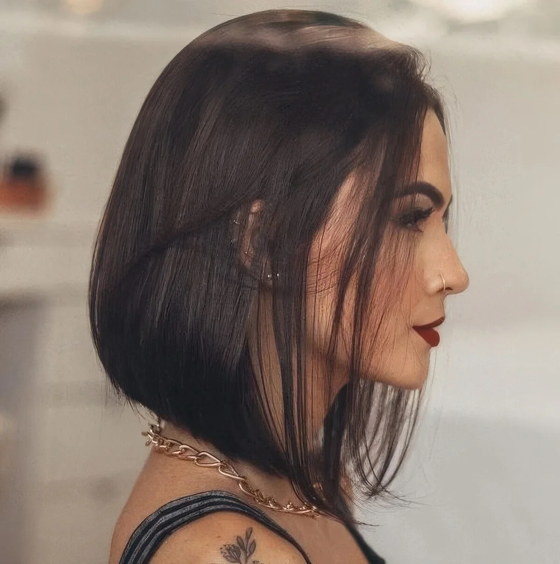 Refined and bold dark brunette A line bob with much volume.
