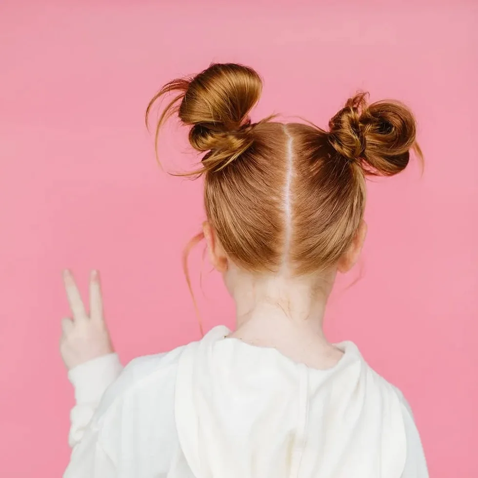 shoulder straight red bun shown as a space buns idea, featuring straight texture