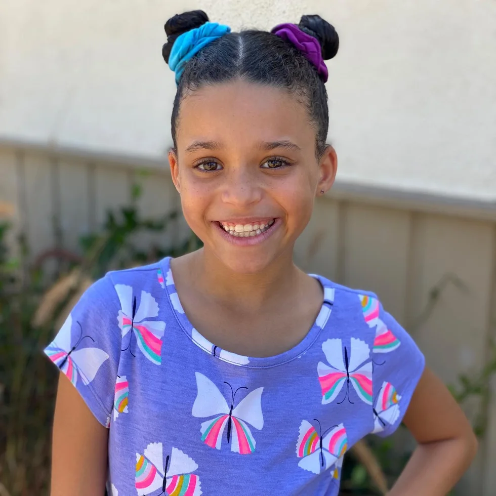 shoulder straight brunette bun shown as a space buns idea, featuring volume through the all over