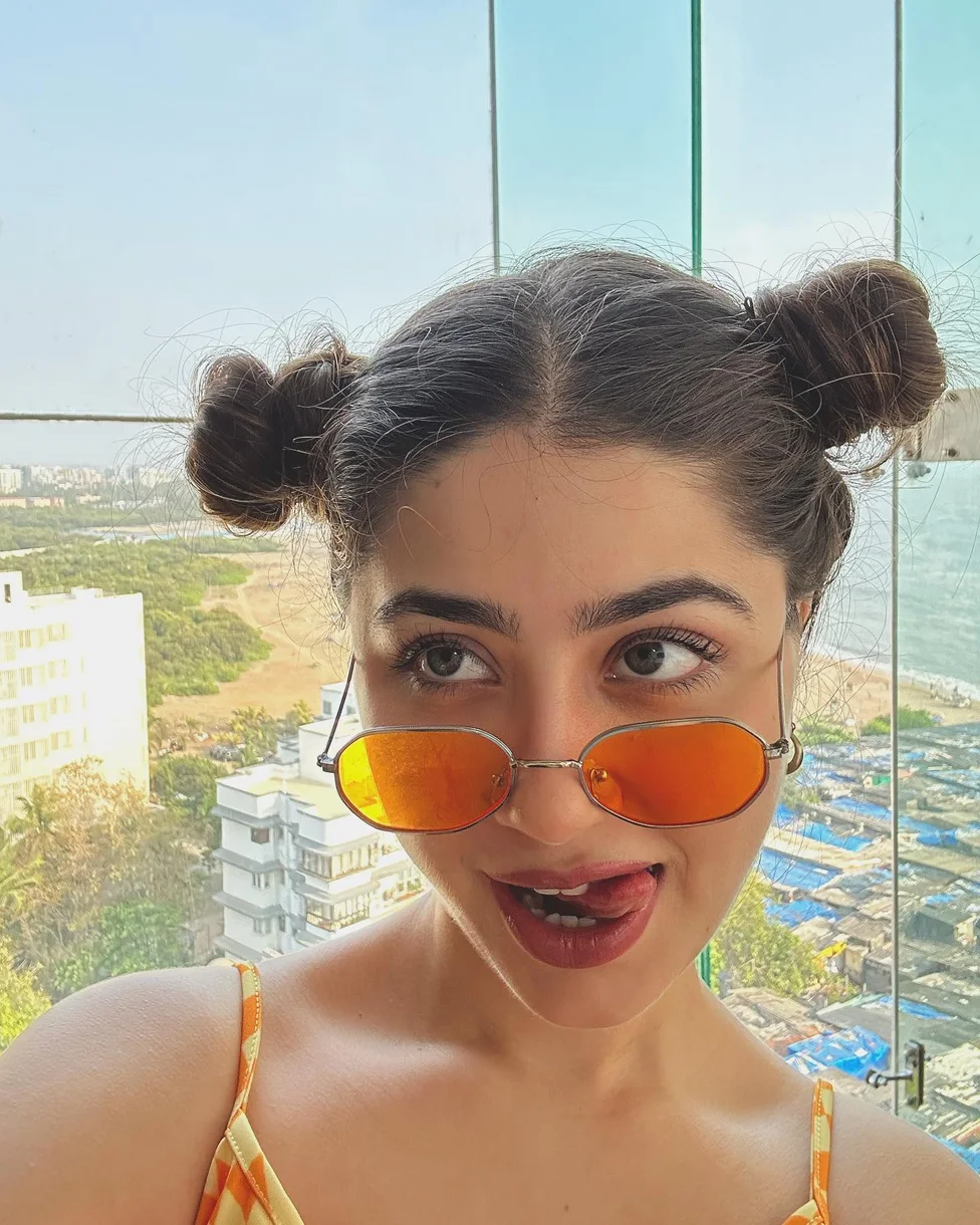 shoulder straight black bun shown as a space buns idea