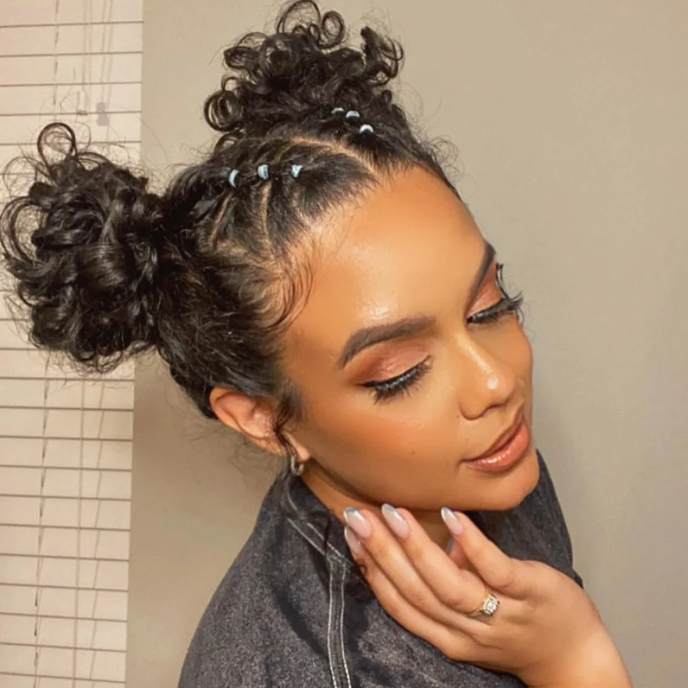 shoulder curly black bun shown as a space buns idea