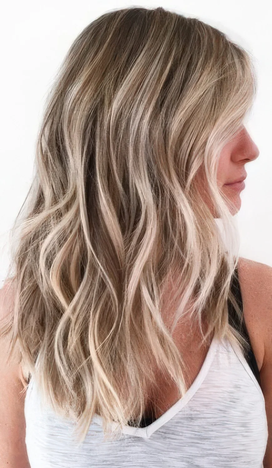 Honey and shiny icy blonde with a darker root and beach waves are.