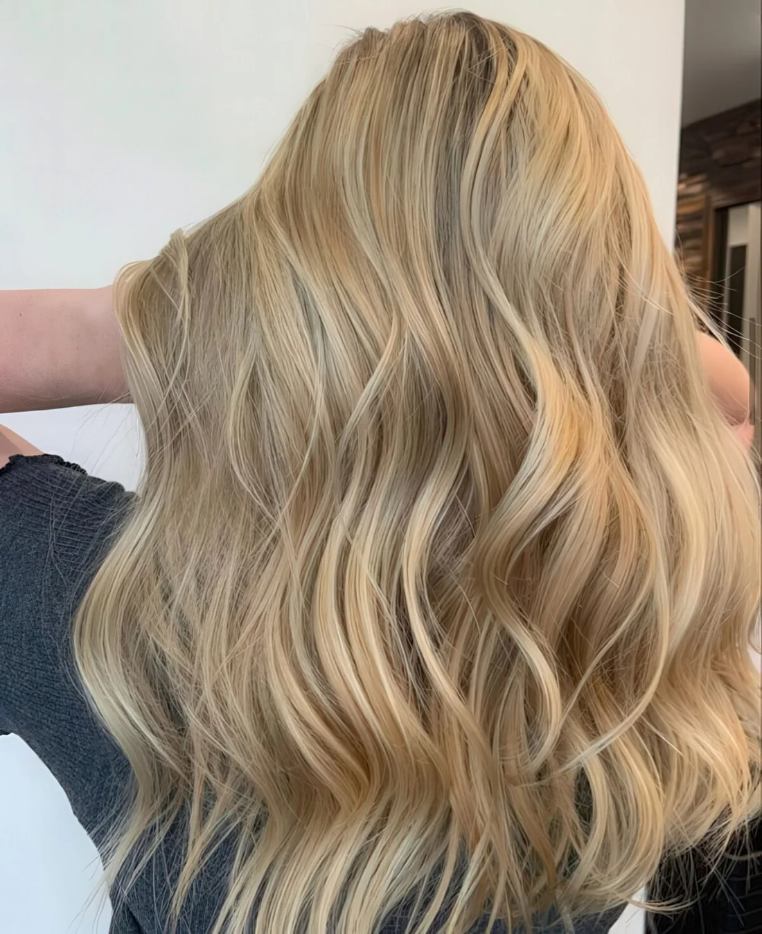 Long sunkissed honey blonde hair with slight waves.