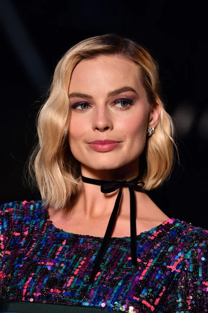 chin wavy chestnut bob shown as a textured bob for thin hair idea, featuring light layering, shown in golden chin bob with loose waves